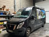 a black van that is parked in a garage