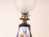 a lamp that has a glass shade on it