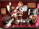 a suitcase filled with assorted items sitting on a table