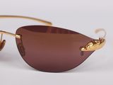 the sunglasses are made of metal and have brown lenses