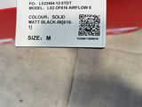 a close up of a shoe box with a shoe tag on it