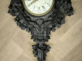 a clock that is on the wall on the floor