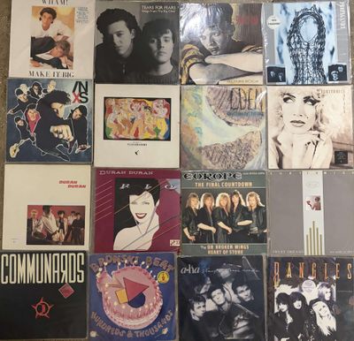 a lot of records on the floor of this room