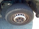 a close up of a flat tire on a truck
