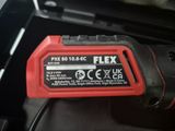 a close up of a red and black battery in a car