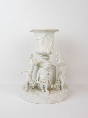 a white vase sitting on a pedestal with a bird on it