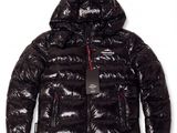 a close up of a black puffy jacket with a hood