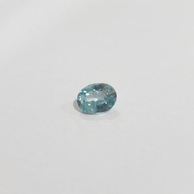 a blue diamond on a white surface