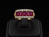 an 18k yellow gold ruby and diamond ring