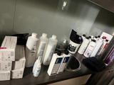 many bottles of hair products on the counter