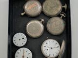 a box with many different types of watches in it