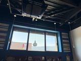 a view of a bar from the window of a restaurant