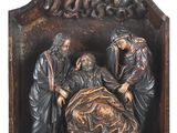 une image représentant une statue d'un homme allongé dans un lit avec une femme et deux hommes