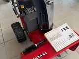 a snow blower sitting on the floor in a store