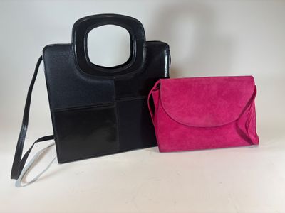 black and pink handbag and purse on a white background