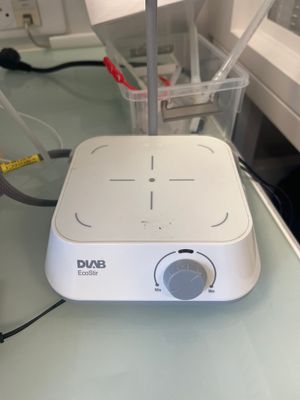 a white device that is sitting on a glass table