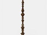 a tall wooden candle holder on a white background