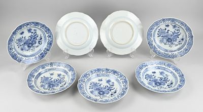 six blue and white plates with floral designs on them