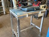 a workbench in a garage with tools on it