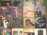 a collage of various album covers on the floor