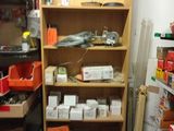 a room with many shelves and bins in it