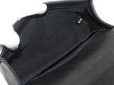the inside of a black purse with a white handle