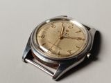 a close up of a wrist watch on a table