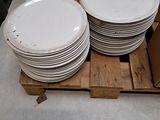 a lot of plates on a pallet in a store