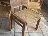 several chairs are lined up on a tile floor in a room