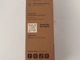 a brown box with a qr code on it sitting on a white surface