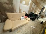 a couch that is sitting in the middle of a room