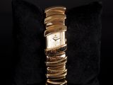 an image of a close up of a wrist watch on a pillow