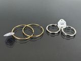 three rings with tags on them sitting next to each other