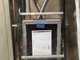 a ladder that is next to a wall with a sign on it