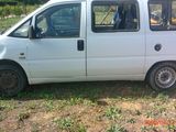 a white van that is parked in the grass