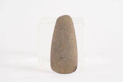 a stone object that is sitting on a white surface