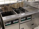 an image of a commercial kitchen with a lot of counter space