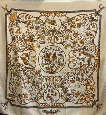 an image of a white and gold scarf hanging on a wall