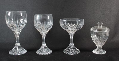 three clear glass goblets and an empty wine glass