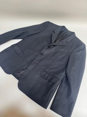 the jacket is blue and has buttons on the front