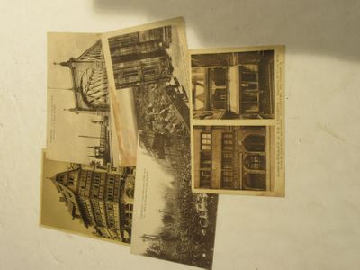 a bunch of old postcards that are on the wall