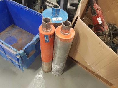 two cylinders that are next to each other on the floor