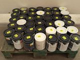many cans of paint sitting on top of a pallet