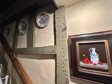 a picture of a painting on the wall next to a staircase
