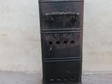 a small metal cabinet with four drawers on top of it