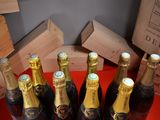 several bottles of wine are lined up in a row on a table