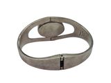 a close up of a silver bracelet with a metal clasp