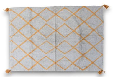 un tapis orange et blanc orné d'un motif en losanges