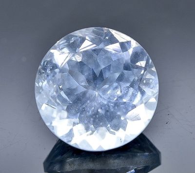 an image of a blue diamond on a black stand