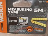 an image of a measuring tape in a plastic case